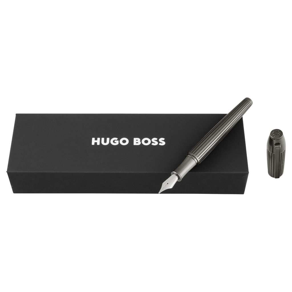 Fountain pen with cap and black box featuring 'Hugo Boss' logo 