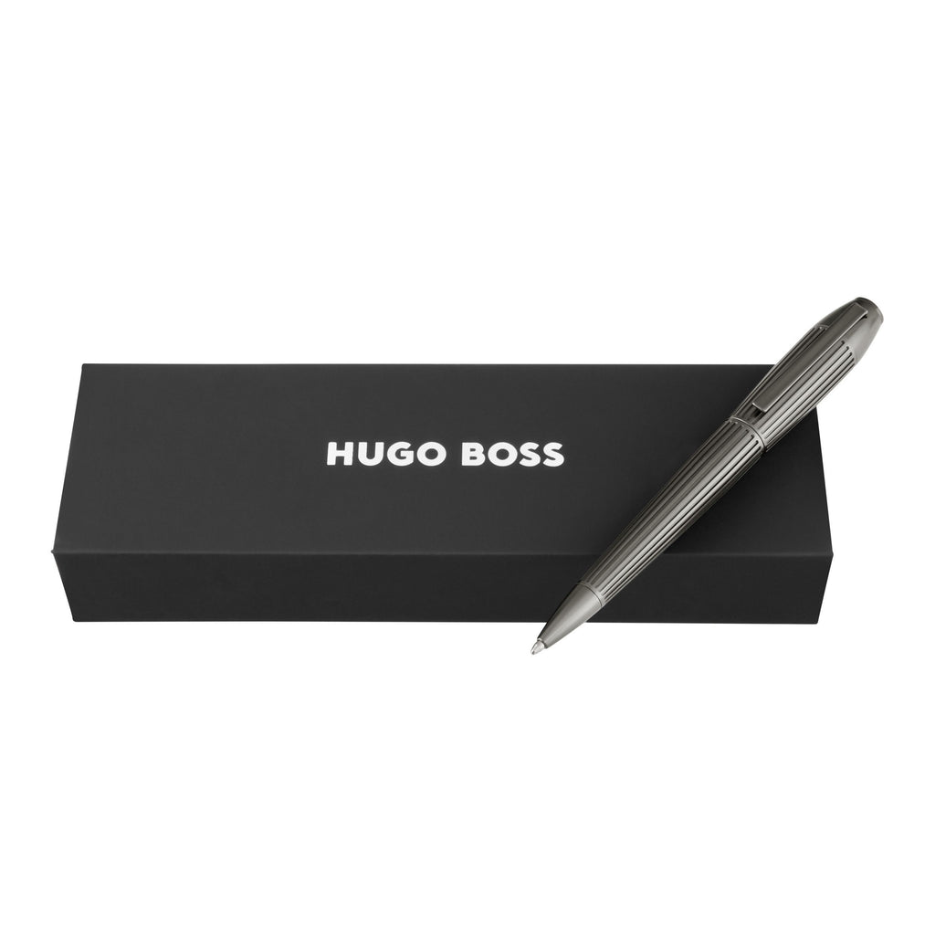 Silver pen with 'Hugo Boss' branding on a black box