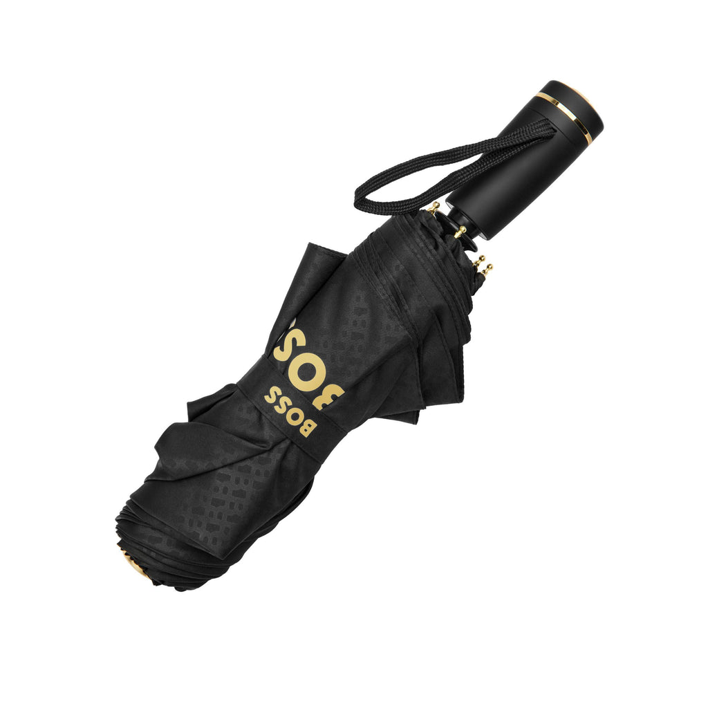 BOSS black umbrella with gold text on a white background