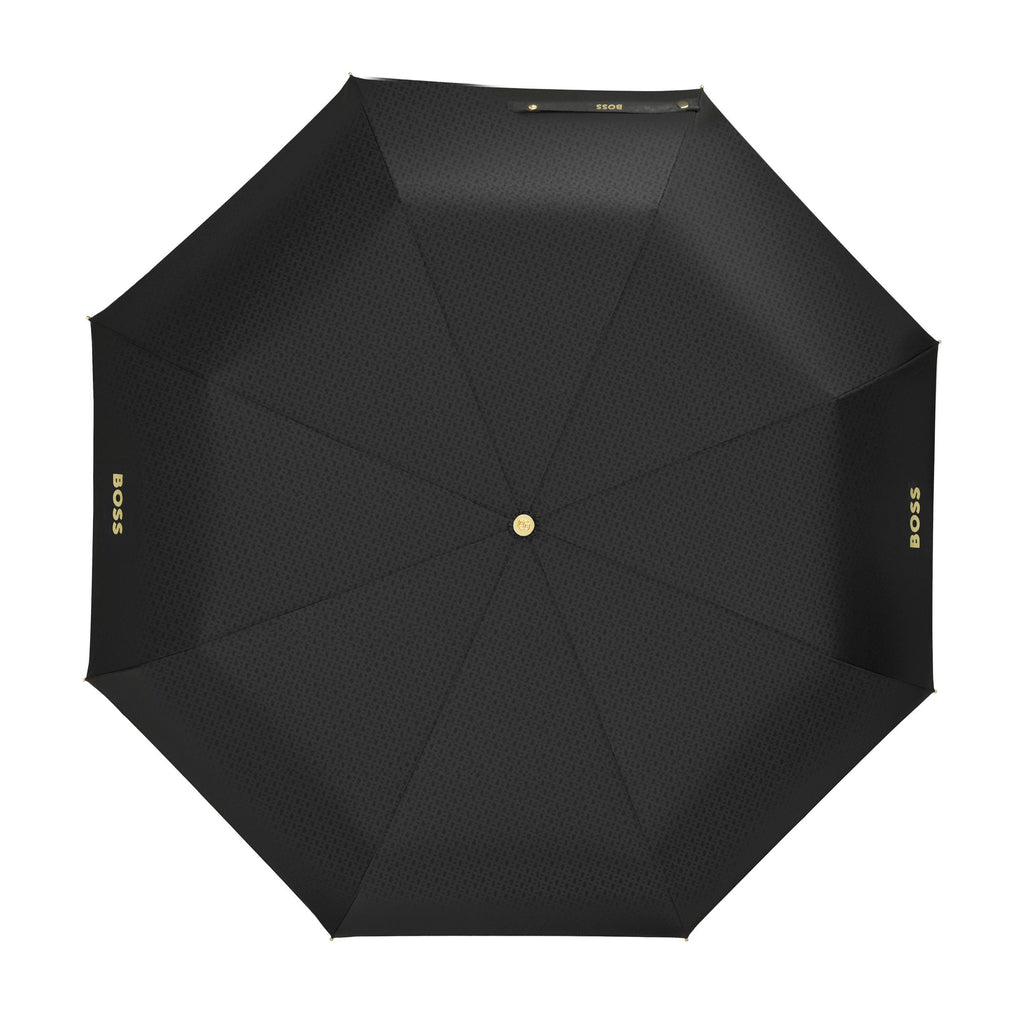 Black umbrella with 'BOSS' branding on a white background